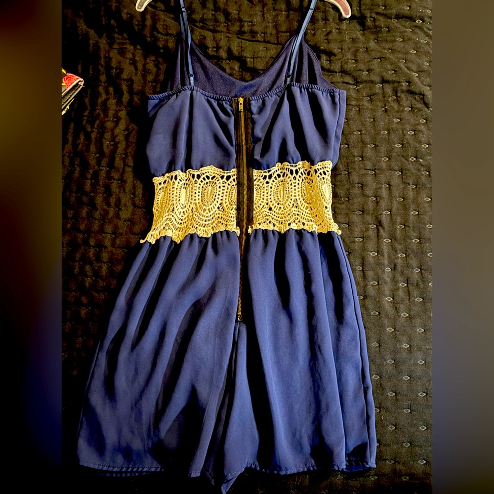 Beautiful romper with see through lace middle around waist